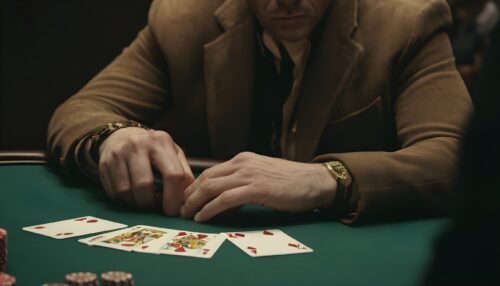 Unknown man with poker cards in a casino - Strategic Advantages in Poker Card Selection and Play - thegamerian.com Best Gaming Websites