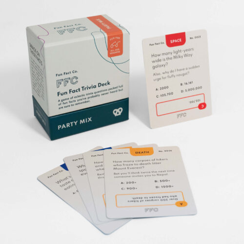 The Party Mix I trivia cards fanned out next to the game box showing sample Space and Death trivia questions