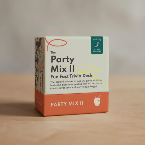 Fun Fact Co. The Party Mix II Trivia Card Game box on a wooden table